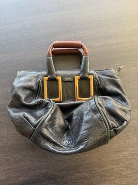 Chloé Black Leather Tote with Gold Hardware and Brown Top Handles
Authentic
